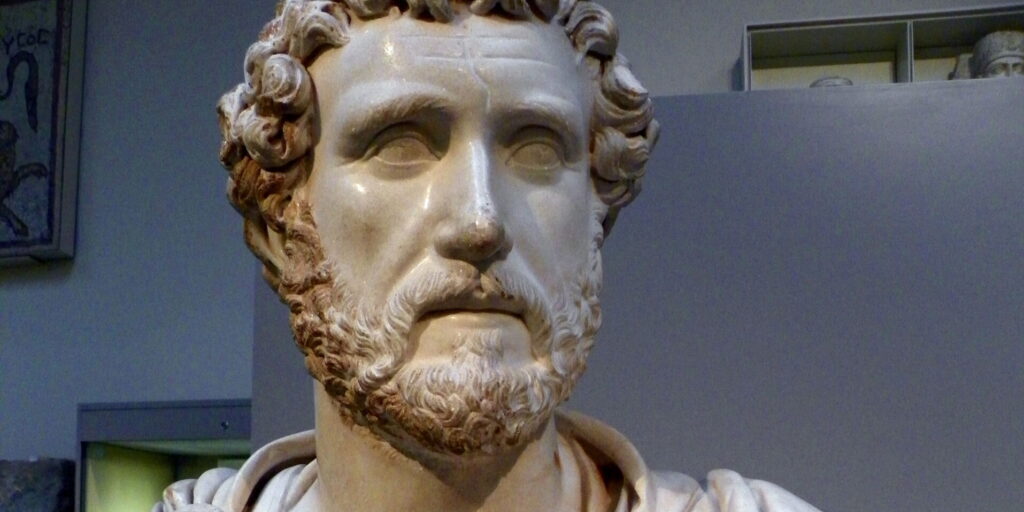 Roman marble bust of the emperor Antoninus Pius (138–161 AD) in military dress, daring to about 140 AD, from the house of Jason Magnus, a prominent citizen of Cyrene, North Africa, now in Room 70 of the British Museum, London. Photographed 12 February 2016.