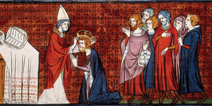 Charlemagne crowned as emperor, c1325-c1350. Charlemagne kneels in front of a bishop and receives his crown. A group of men stand behind the emperor and watch the ceremony. From "Chroniques de France ou de Saint Denis".