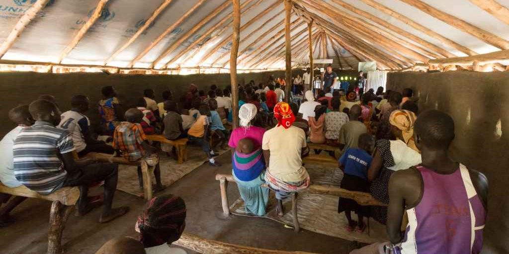 An IMB missionary speaks to the mostly South Sudanese congregation of First Baptist Church Maaji#2 in the Adjumani Settlement in northwestern Uganda. Many peoples from ethnic groups that were previously very difficult to reach have now migrated south to refugee camps in Uganda in search of peace.